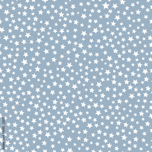 All over seamless repeat pattern with ditsy tiny little cute hand drawn white stars on a dusty muted chambray blue background