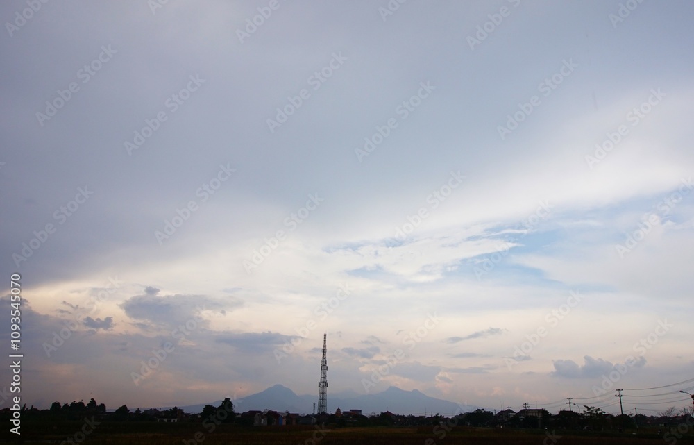 photos of tall towers and mountain silhouettes and cloudy skies photos of tall towers and mountain silhouettes and cloudy skies
