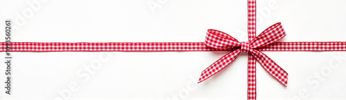 Red gingham ribbon and bow on white background
