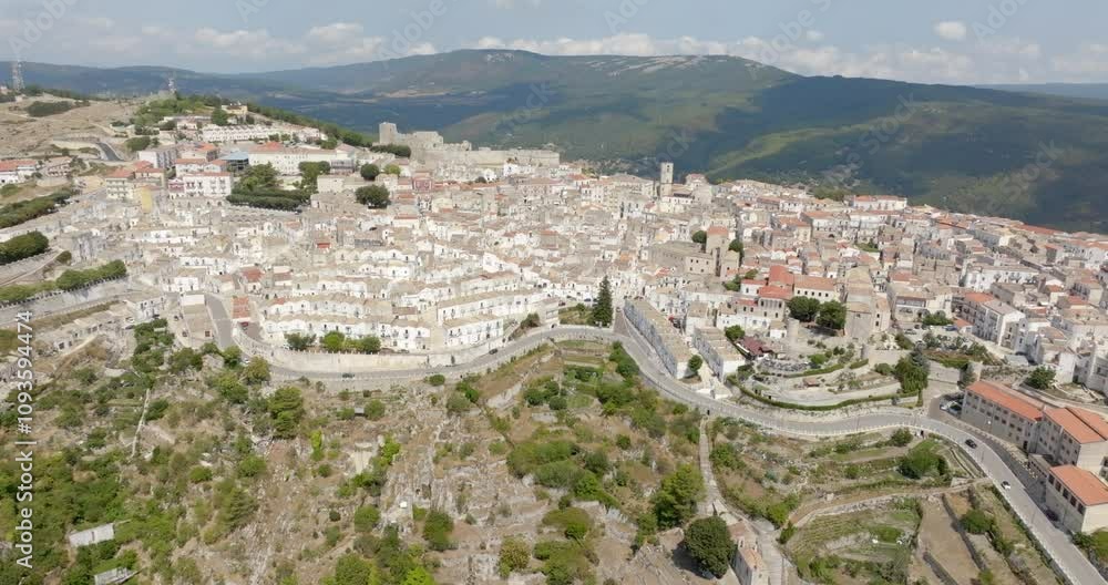 Panoramic aerial view of the town of Monte Sant'Angelo, in the province of Foggia, Apulia. It is a typical village of Southern Italy located on Mount Gargano. Panoramic aerial view of the town of Monte Sant'Angelo, in the province of Foggia, Apulia. It is a typical village of Southern Italy located on Mount Gargano.