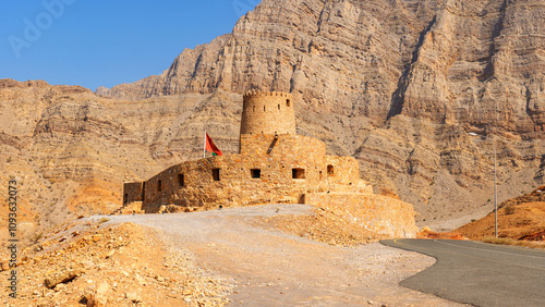 historic stone fort in Bukha, Musandam, Oman, against the backdrop of mountains. Al Qalaa Fort