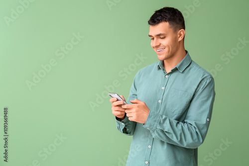 Young man using mobile phon...