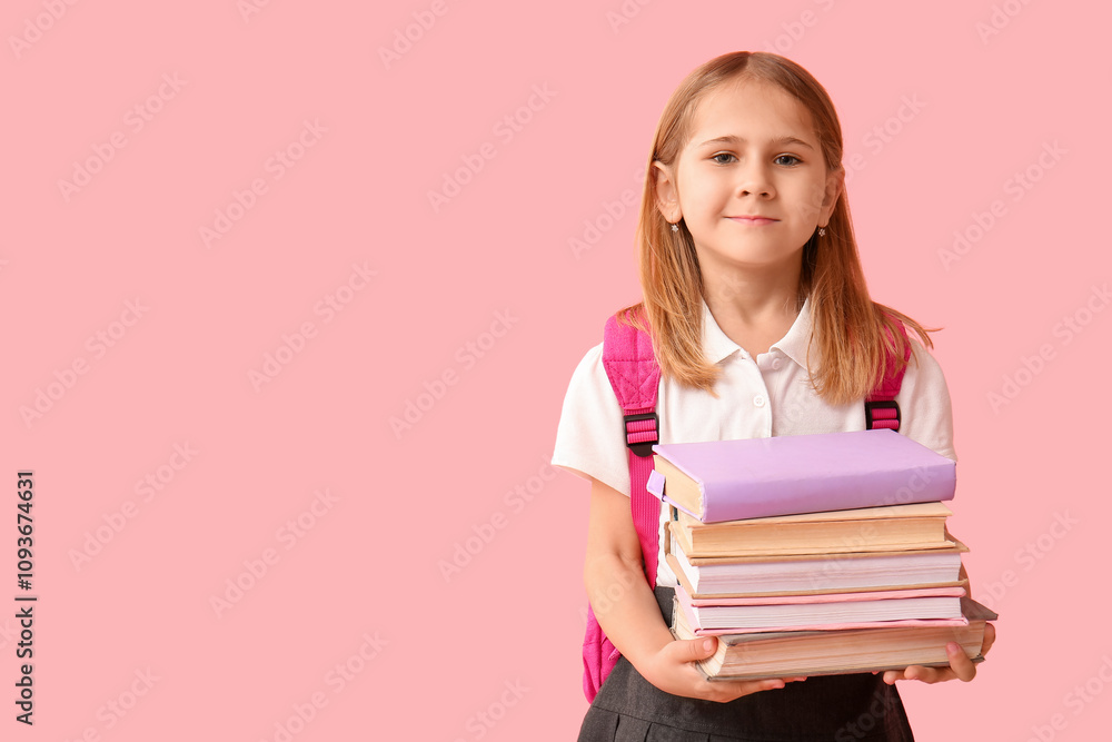 Cute little schoolgirl with backpack and books on pink background Cute little schoolgirl with backpack and books on pink background