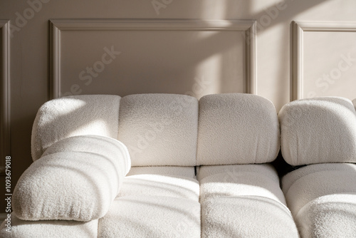 Cozy modern living room with plush white sectional sofa and elegant design