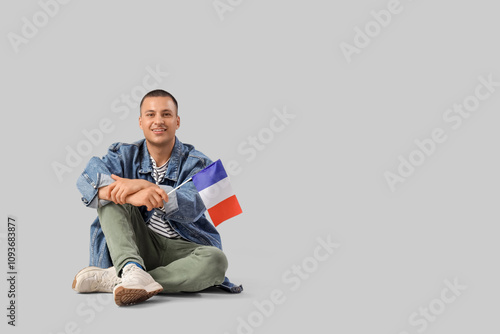 Young man with flag of Fran...