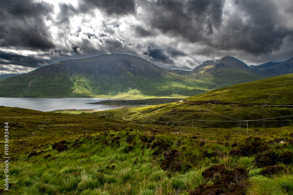 Naklejka premium Rural Landscape With Beaches And Mountains At The Atlantic Coast Of The Isle Of Skye In Scotland, UK