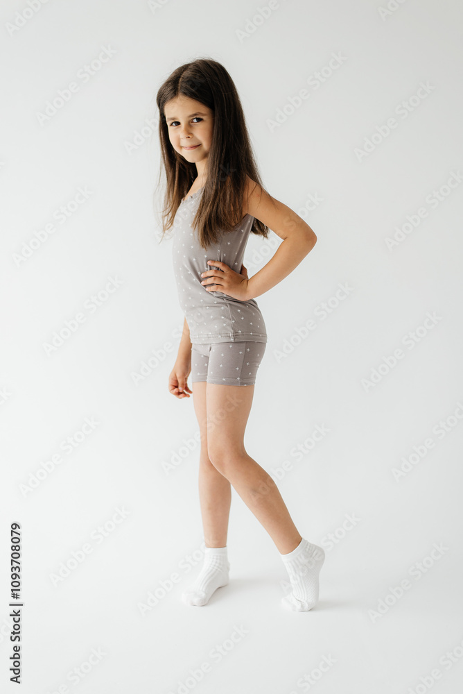 Full body photo of funny girl. good mood, party pajamas, empty space checkered pajama pants isolated white studio Full body photo of funny girl. good mood, party pajamas, empty space checkered pajama pants isolated white studio