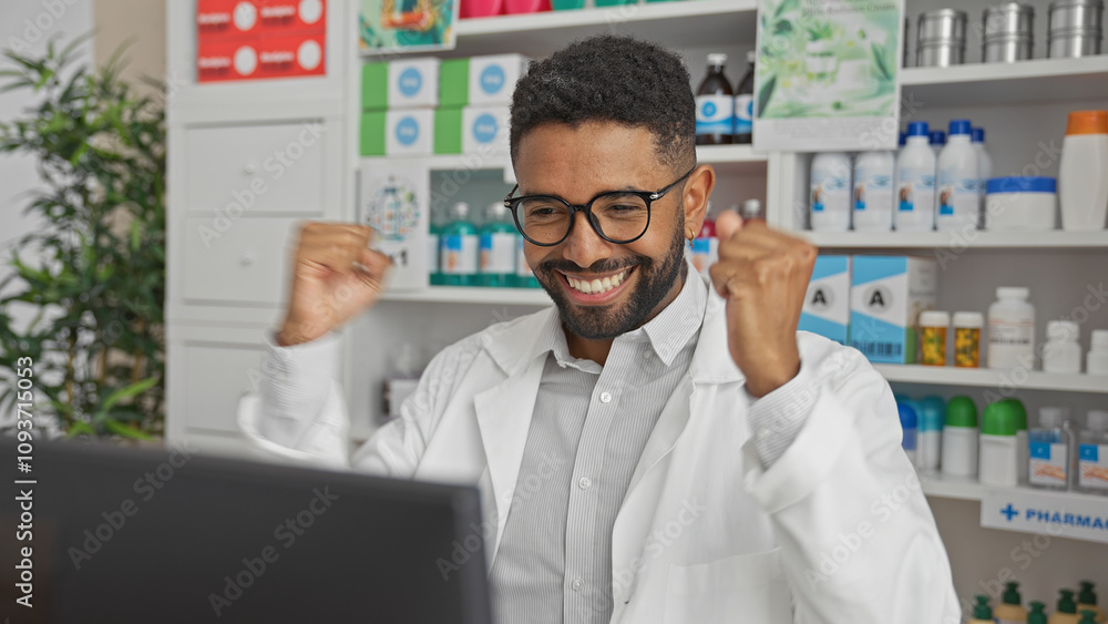 Cheerful male pharmacist celebrating success in a well-stocked pharmacy interior Cheerful male pharmacist celebrating success in a well-stocked pharmacy interior