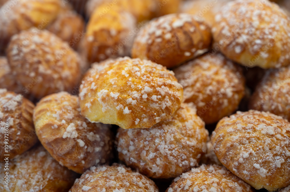 Chouquettes or petits choux are small pieces of French patisserie consisting of small spheres of choux pastry, sugared and baked, Bordeaux, France Chouquettes or petits choux are small pieces of French patisserie consisting of small spheres of choux pastry, sugared and baked, Bordeaux, France