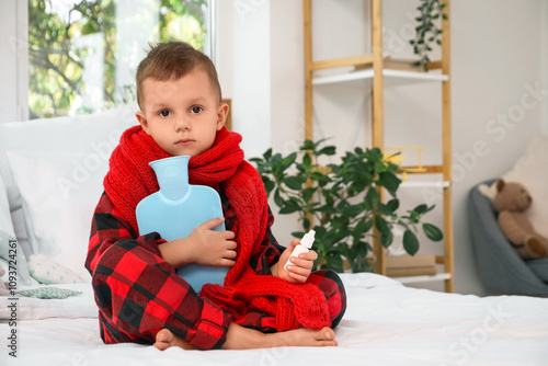 Sick little boy with hot wa...
