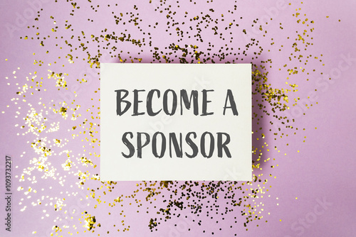 Konstfotografi White sign with gold glitter on it that says Become a Sponsor