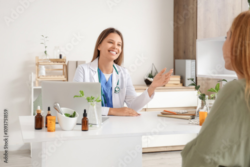 Konstfotografi Female homeopathic doctor working with patient at table in office