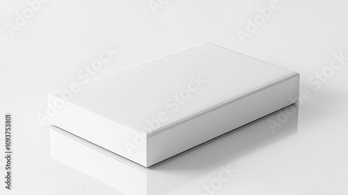 A sleek rectangular white box with rounded corners, resting neatly on a glossy white surface