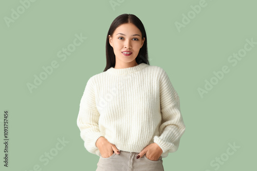 Smiling young asian woman i...