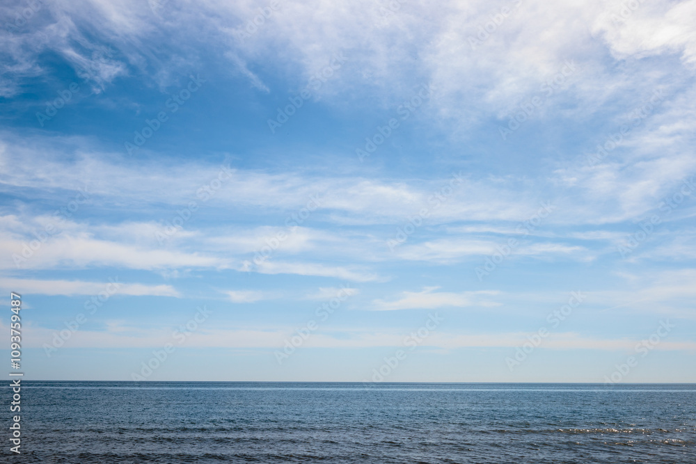 Wispy clouds over Lake Michigan off the coast of \Harrington Beach State Park, Belgium, Wisconsin in early June Wispy clouds over Lake Michigan off the coast of \Harrington Beach State Park, Belgium, Wisconsin in early June