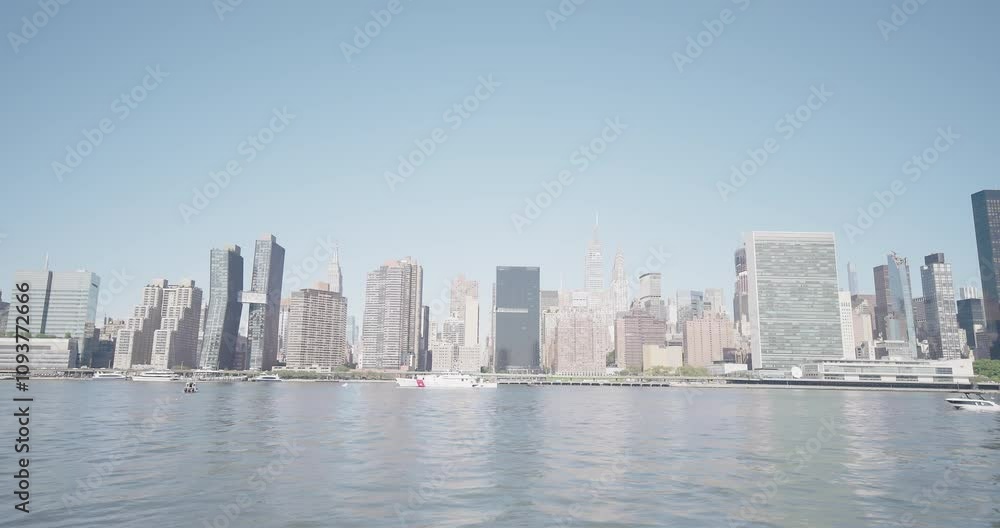 Boat Crossing Frame Right to Frame Left, Patrol Boat, East Side Manhattan Skyline in BG - 4K 48fps ProRes Boat Crossing Frame Right to Frame Left, Patrol Boat, East Side Manhattan Skyline in BG - 4K 48fps ProRes
