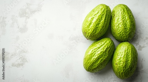 Wallpaper Mural Four vibrant green cacao pods sit on a textured white background. Torontodigital.ca