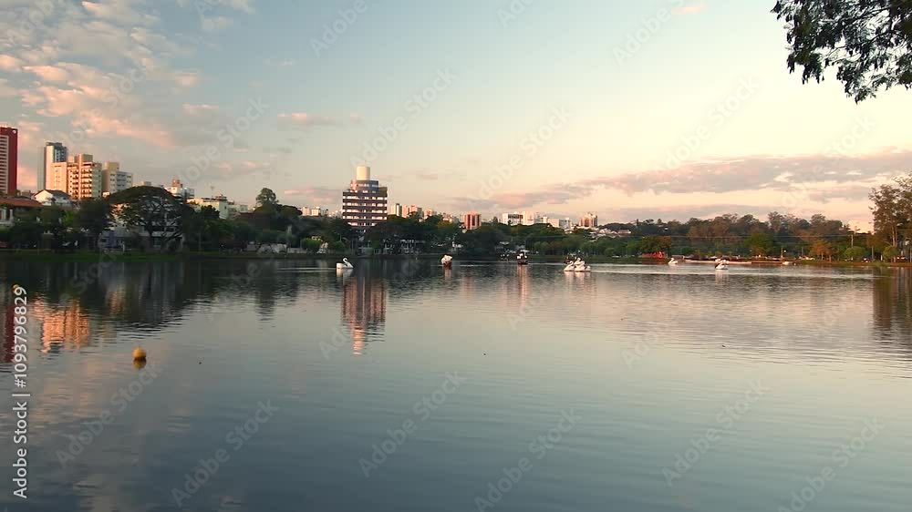 Ipago Lake of Londrina city, Parana, Brazil. Beautiful landscape at the end of the afternoon on the shore of the lake. Ipago Lake of Londrina city, Parana, Brazil. Beautiful landscape at the end of the afternoon on the shore of the lake.