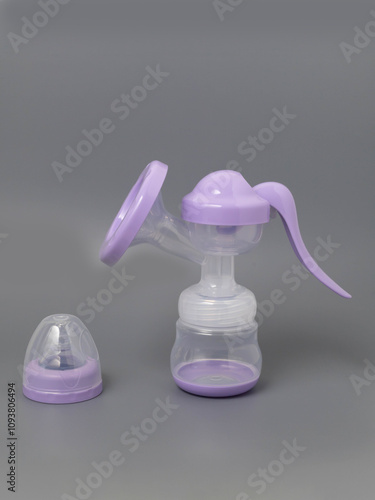 Breast pump bottles on a gray background