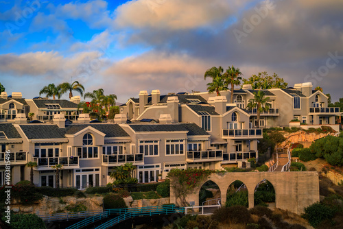 Sunset over luxury homes in Dana Point harbor, Orange County in Southern California on a cloudy day