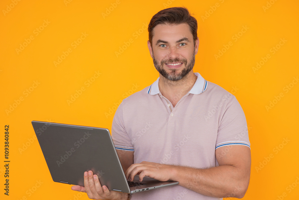 Man using laptop. Man worker watch video on computer laptop. Serious man hold laptop computer. Caucasian man in glasses work with laptop, studio isolated portrait. Man using laptop. Man worker watch video on computer laptop. Serious man hold laptop computer. Caucasian man in glasses work with laptop, studio isolated portrait.