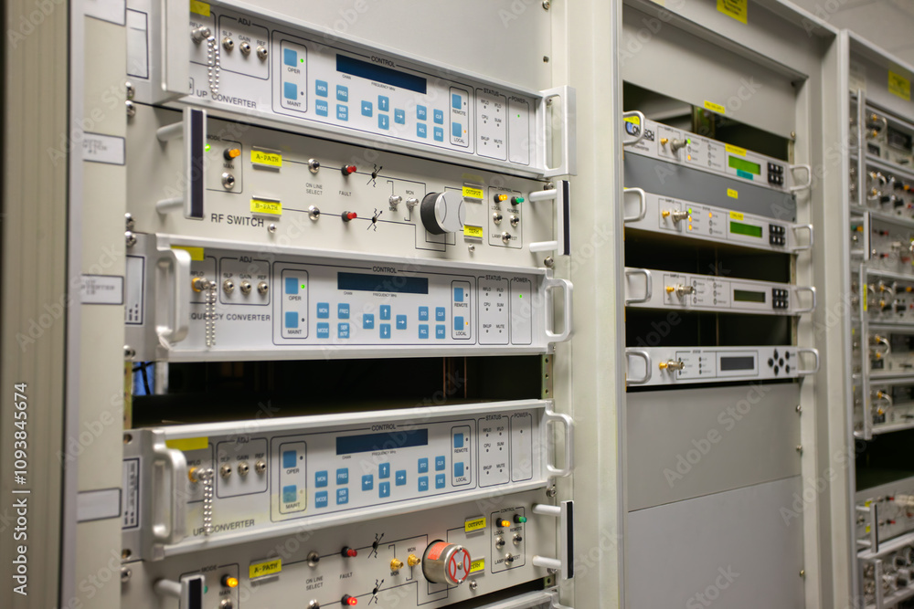 RF switch equipment frequency convertor in a data center, rack server, satellite connections equipment indoors at the station, emission analyzers RF switch equipment frequency convertor in a data center, rack server, satellite connections equipment indoors at the station, emission analyzers