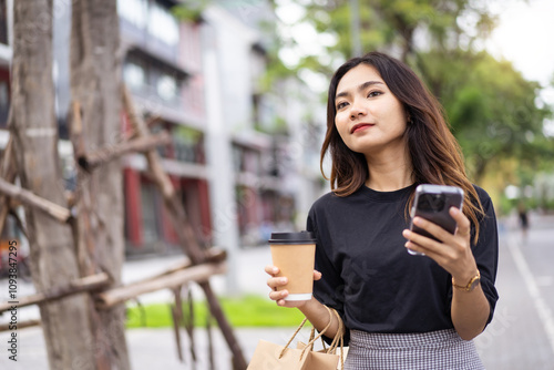 Asian businesswoman walking on the street in city.