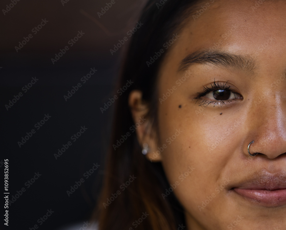 © Wavebreak Media - Close-up of asian female teenager smiling with nose ring and earrings, copy space, at home © Wavebreak Media - Close-up of asian female teenager smiling with nose ring and earrings, copy space, at home