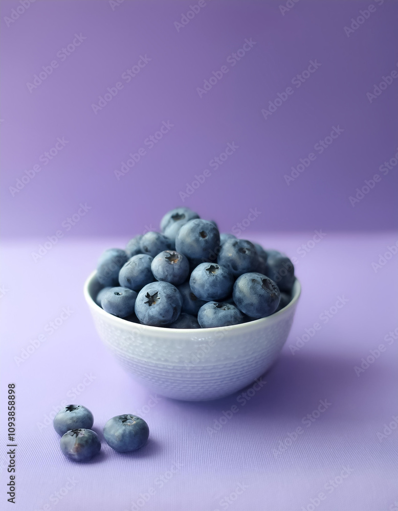 Blueberry in a bowl on Soft lilac background