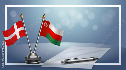 Denmark and Oman National flags on small table with bokeh background, cooperative relationship