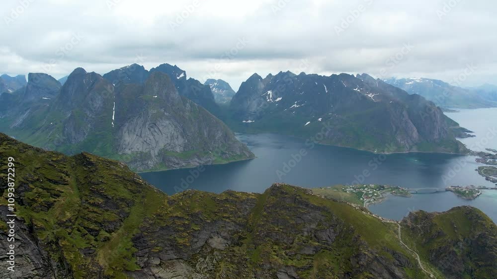 Unveil the mystery of Reinebringen Mountain with this breathtaking 4K drone footage. Witness the stunning beauty of this iconic peak and the surrounding fjords. Unveil the mystery of Reinebringen Mountain with this breathtaking 4K drone footage. Witness the stunning beauty of this iconic peak and the surrounding fjords.