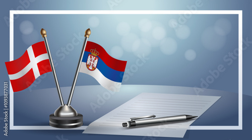 Denmark and Serbia National flags on small table with bokeh background, cooperative relationship