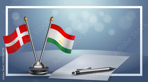 Denmark and Tajikistan National flags on small table with bokeh background, cooperative relationship