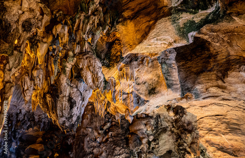 Buddhist cave temple close up stone walls southeast asia photo