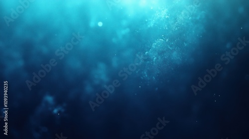 Abstract blue underwater scene with particles.