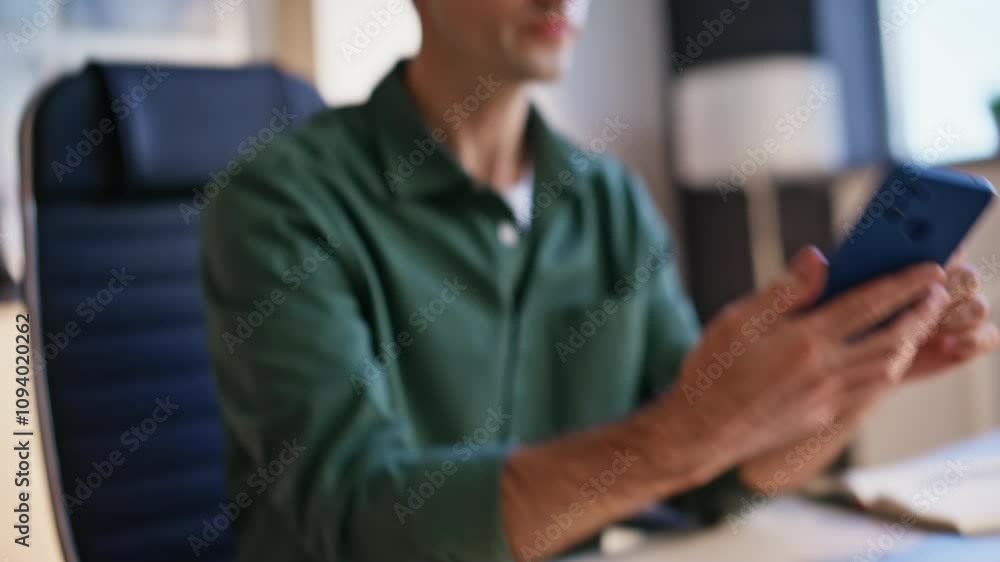 Employee hands typing laptop receiving smartphone message closeup. Surprised man Employee hands typing laptop receiving smartphone message closeup. Surprised man