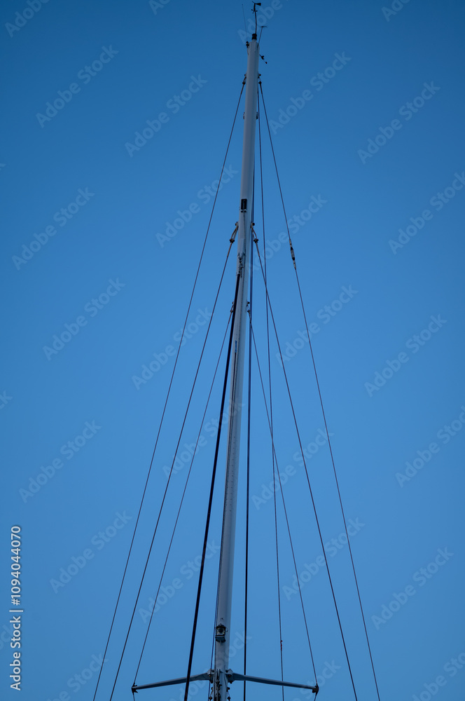 Black and White mast of a Ship Against Blue Sky. Black and White mast of a Ship Against Blue Sky.