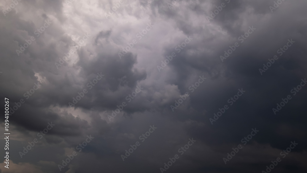Dark sky with stormy clouds. Dramatic sky rain,Dark clouds before a thunder-storm. Dark sky with stormy clouds. Dramatic sky rain,Dark clouds before a thunder-storm.
