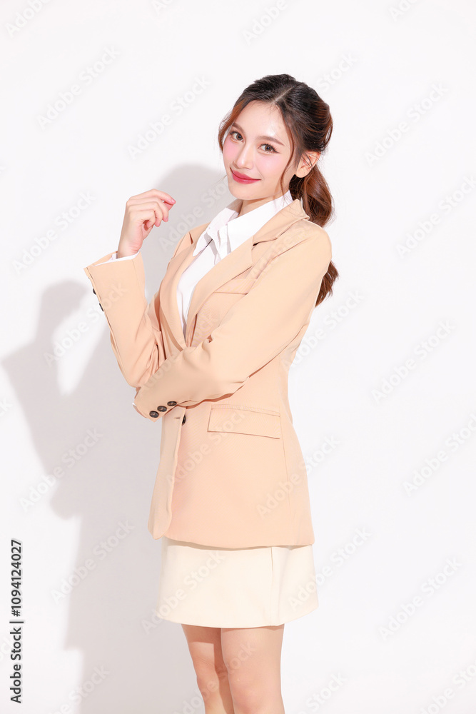 Smiling young Asian business woman leader entrepreneur wearing stylish suit arms crossed on isolated background. Smiling young Asian business woman leader entrepreneur wearing stylish suit arms crossed on isolated background.
