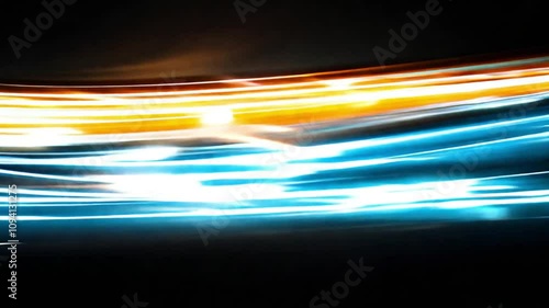 Abstract Representation of Speed and Movement with Blurry Light Trails in Blue, Orange, and White Hues