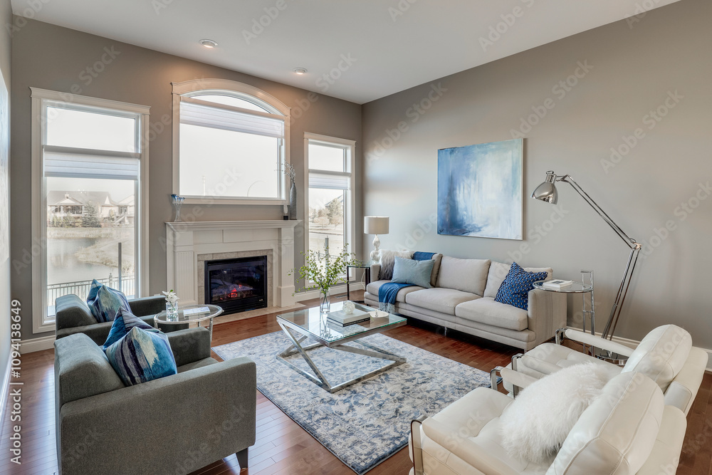 Fototapeta premium A living room with a fireplace, a couch, and a coffee table