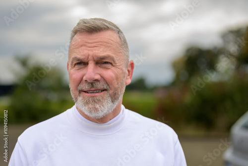 Outdoors Portrait of a Mature Man with a Friendly Expression