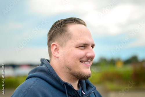 Side Profile of Smiling Man in Natural Light