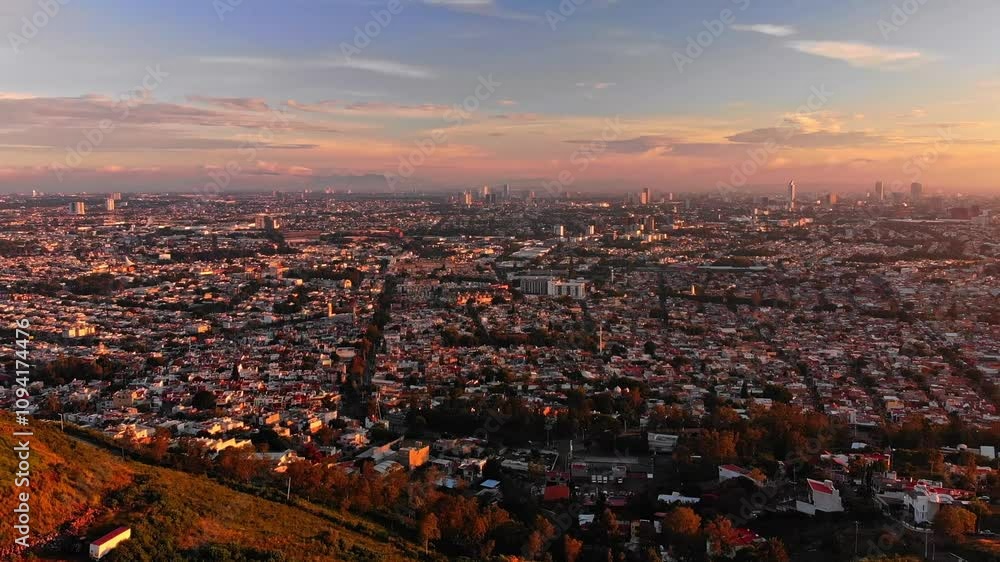 DRONE : TIMELAPSE AND ZOOM OUT OF A LANDSCAPE OF GUADALAJARA CITY IN MEXICO AT SUNSET DRONE : TIMELAPSE AND ZOOM OUT OF A LANDSCAPE OF GUADALAJARA CITY IN MEXICO AT SUNSET