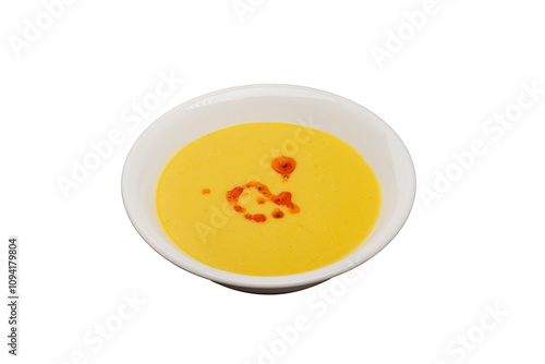 Lentil Soup from traditional Turkish cuisine. Isolated on a white background. Made with red lentils and served with sauce.