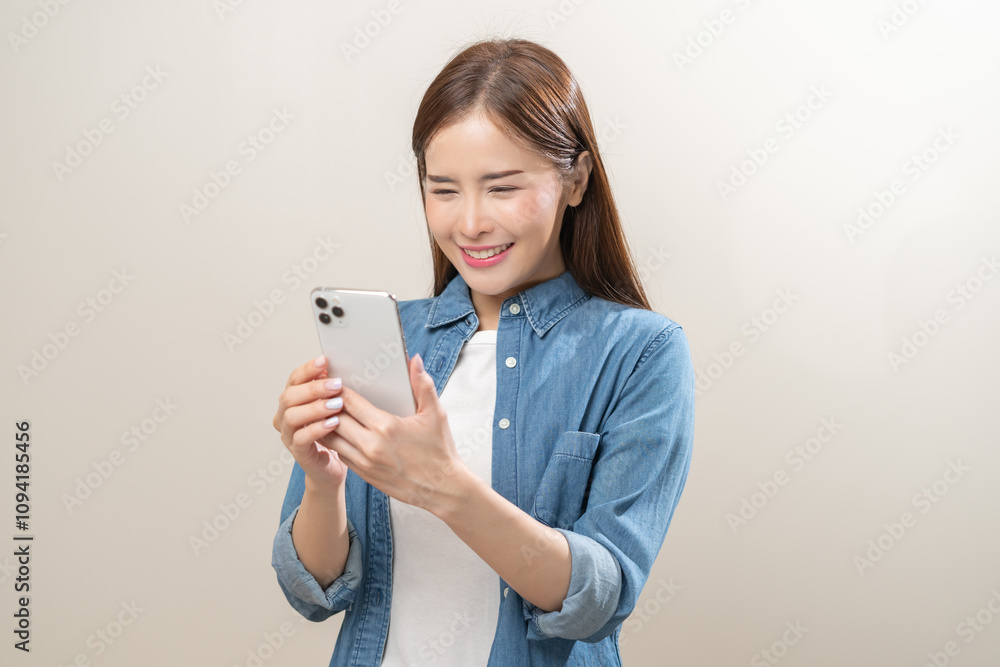Happy asian young woman using mobile smart phone, read good news online, laugh excited getting offer, great positive surprise, celebrate success on smartphone. Smile girl isolated on white background. Happy asian young woman using mobile smart phone, read good news online, laugh excited getting offer, great positive surprise, celebrate success on smartphone. Smile girl isolated on white background.
