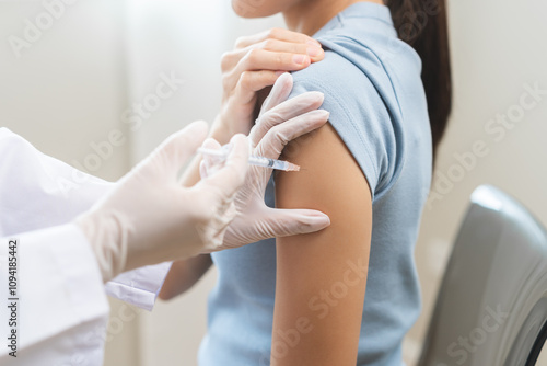 Фотография Health care, corona virus, hand of woman nurse, doctor giving syringe vaccine, injection dose on arm sick patient at clinic
