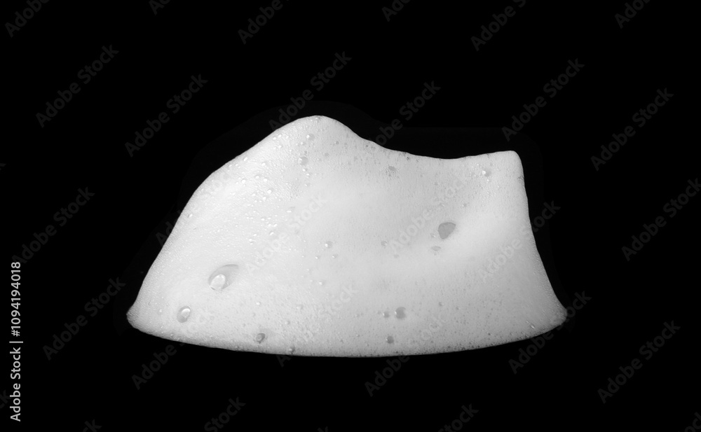 Liquid white foam from soap or shampoo or bath bubbles. Abstract soap bubbles. Soap bubbles set. Soap bubbles isolated on black with texture and contrast background. Liquid white foam from soap or shampoo or bath bubbles. Abstract soap bubbles. Soap bubbles set. Soap bubbles isolated on black with texture and contrast background.