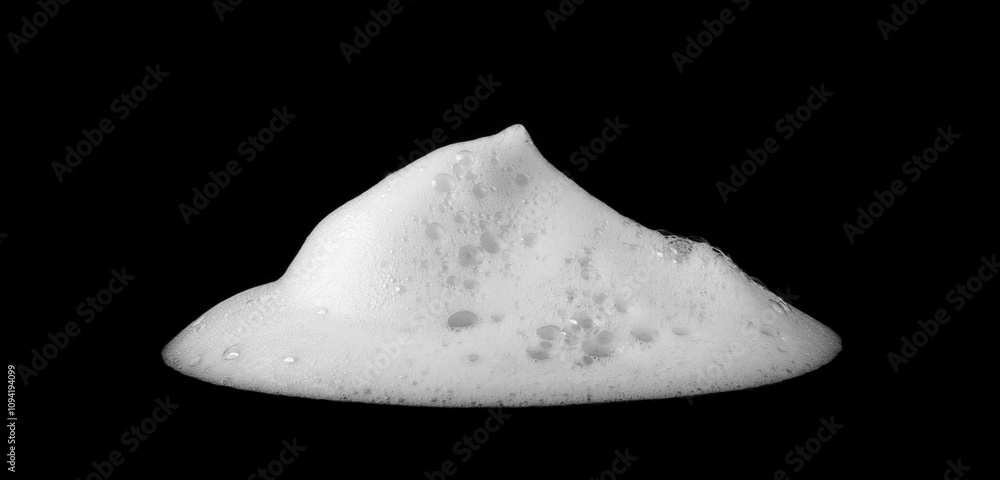Liquid white foam from soap or shampoo or bath bubbles. Abstract soap bubbles. Soap bubbles set. Soap bubbles isolated on black with texture and contrast background. Liquid white foam from soap or shampoo or bath bubbles. Abstract soap bubbles. Soap bubbles set. Soap bubbles isolated on black with texture and contrast background.