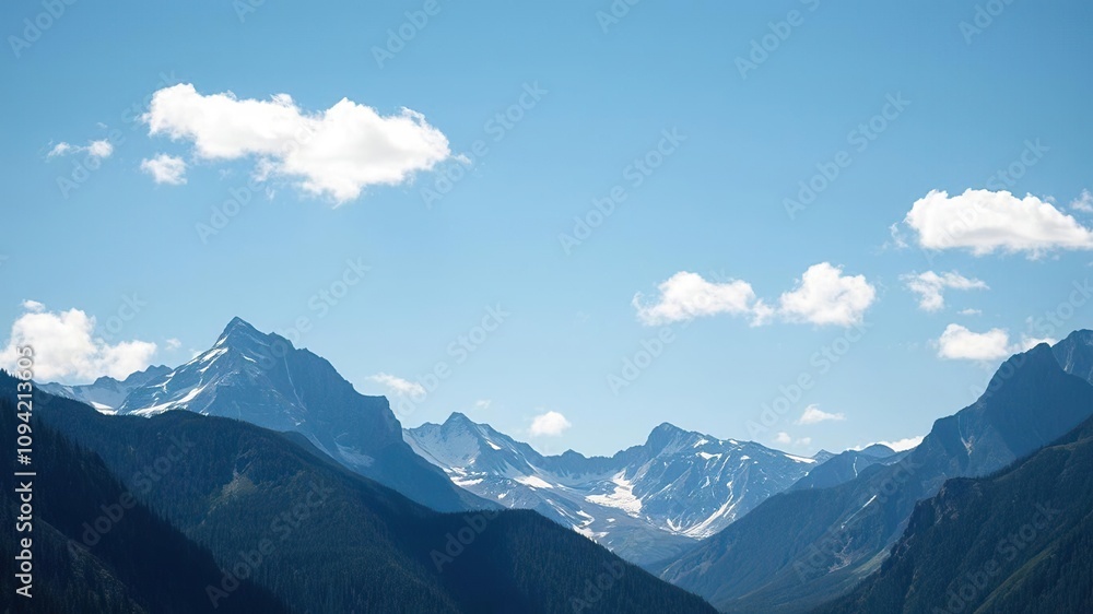 majestic mountain range with blue sky and few scattered clouds, wilderness, landscape majestic mountain range with blue sky and few scattered clouds, wilderness, landscape